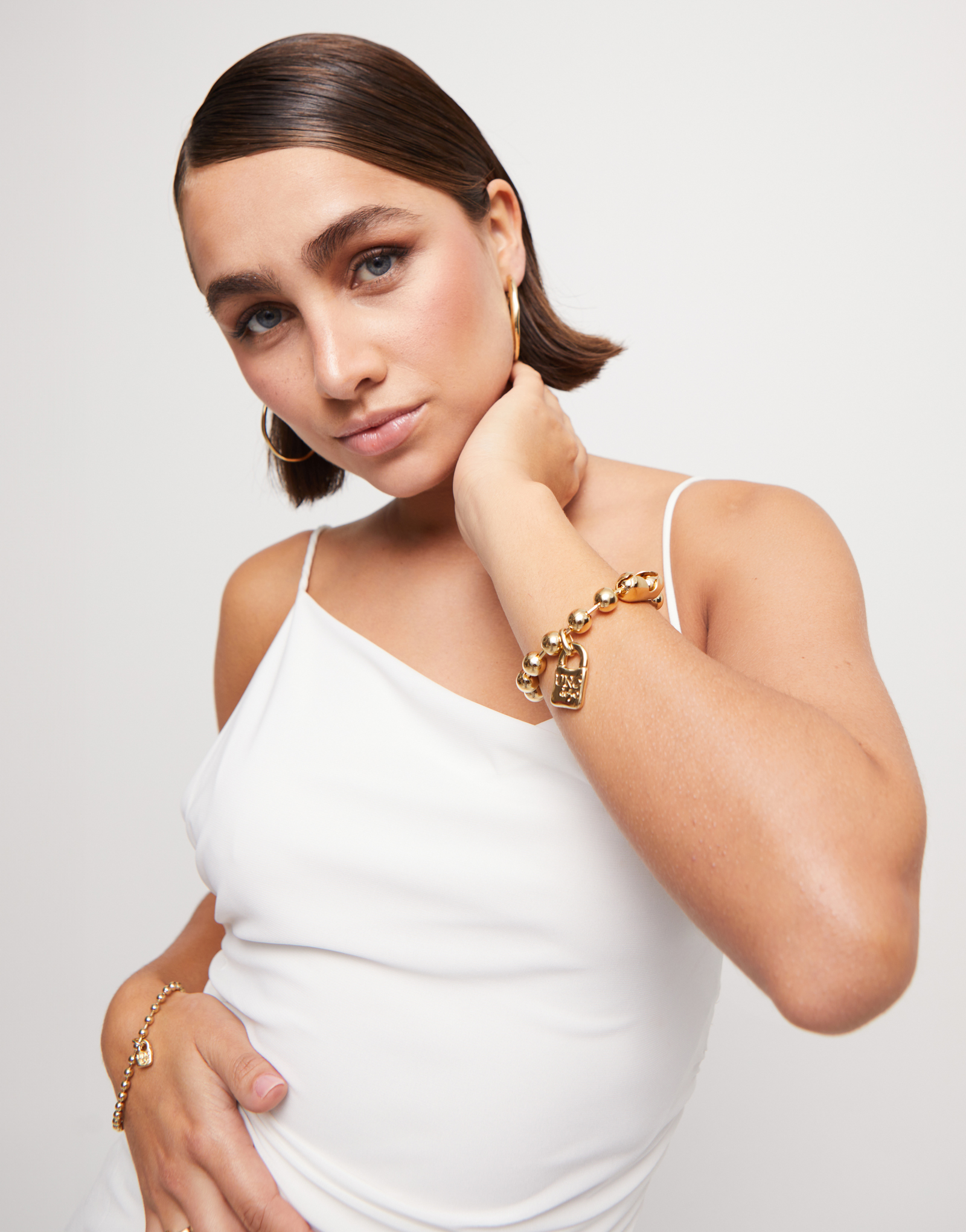 Beaded bracelet with a padlock charm, Golden, large thumbnail